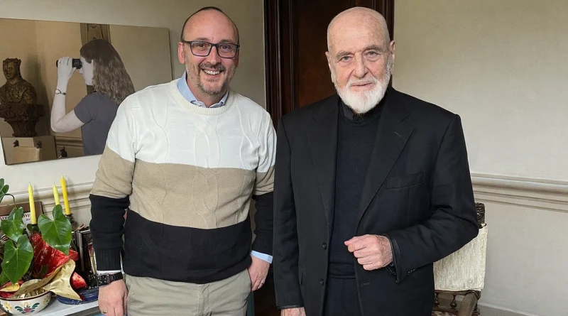 Michelangelo Pistoletto with Antonino La Vela, with a mirror painting in the background.