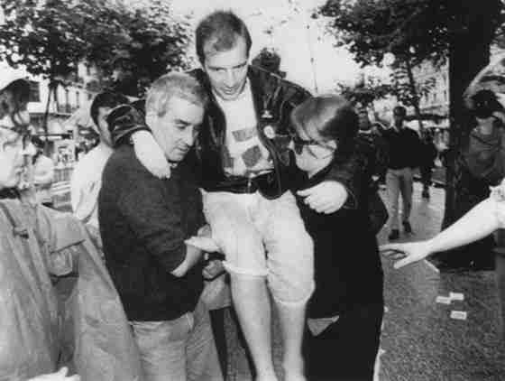 Pepe Espaliú being carried through the streets of Madrid during his 1992 performance Carrying.
